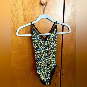 Robin Piccone black/floral one piece swimsuit. Cute crisscrossed back straps!
